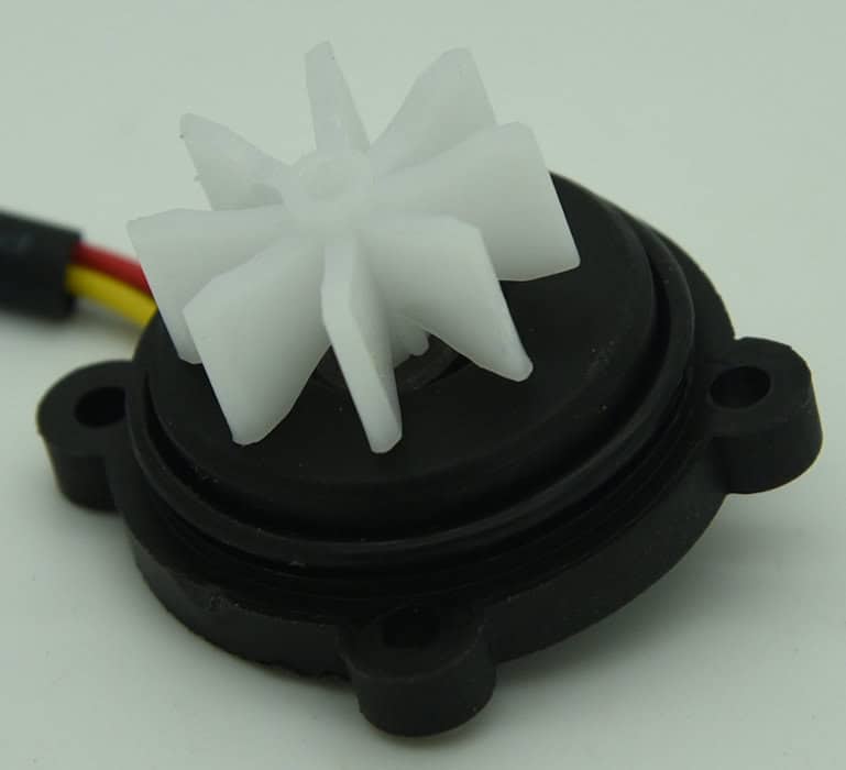 Turbine and magnet in housing