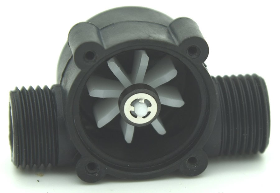 Turbine with magnet in its housing