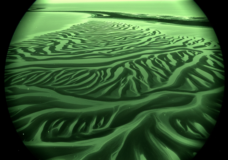 Sediment Swirls in Arctic Chill